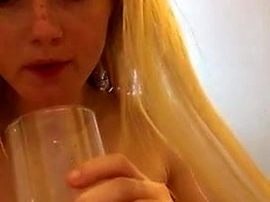 cute blonde girl pissing and drinking own